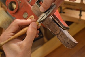Using a square and marking knife to clean up the notch.