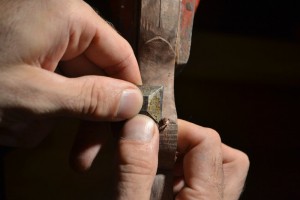 Using a chisel to create a flat just in front of the notch or clip,