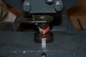 Setting the clearance between the die and punch. I used a sheet of newspaper for a shim.
