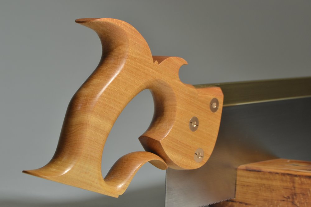 Close-up of handle on 12 inch  carcase saw in American beech