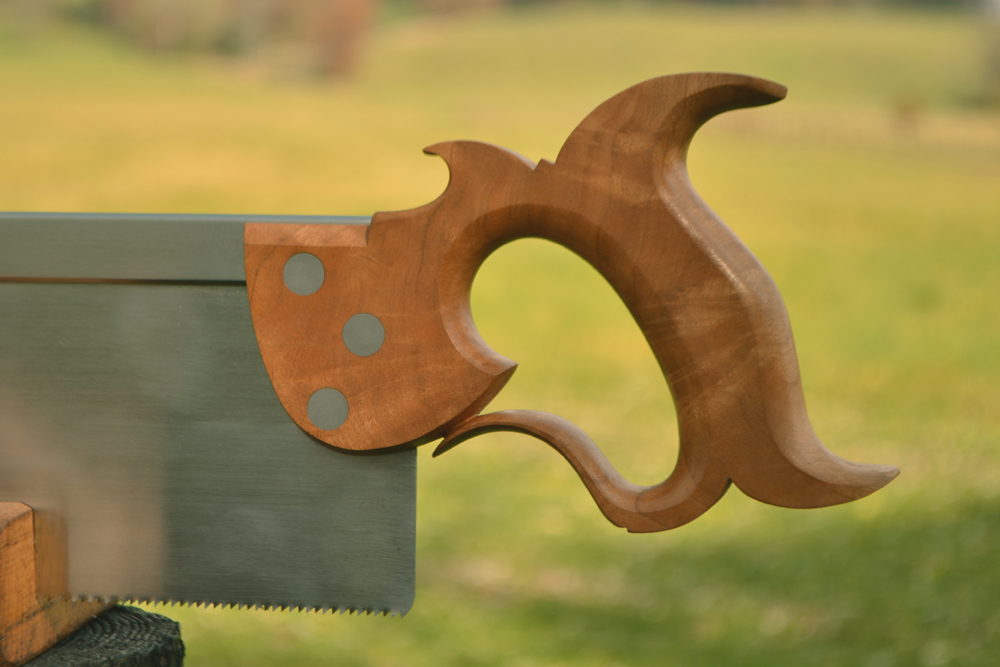 Handle closeup view of 14 inch sash saw in cherry crotch