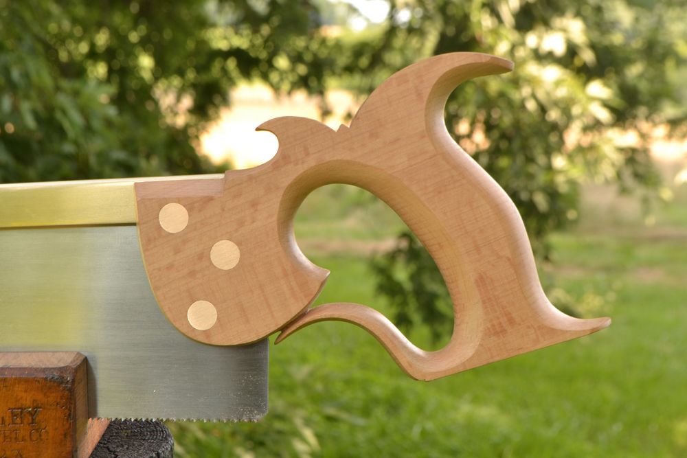 Closeup of Smith's Key carcase saw handle in European beech