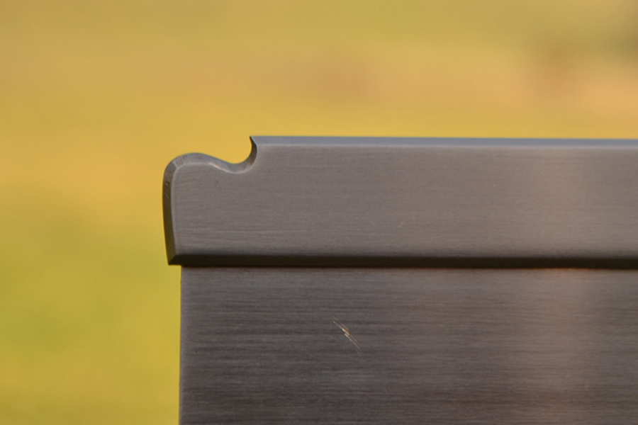 Lamb's tongue detail on stainless steel spine