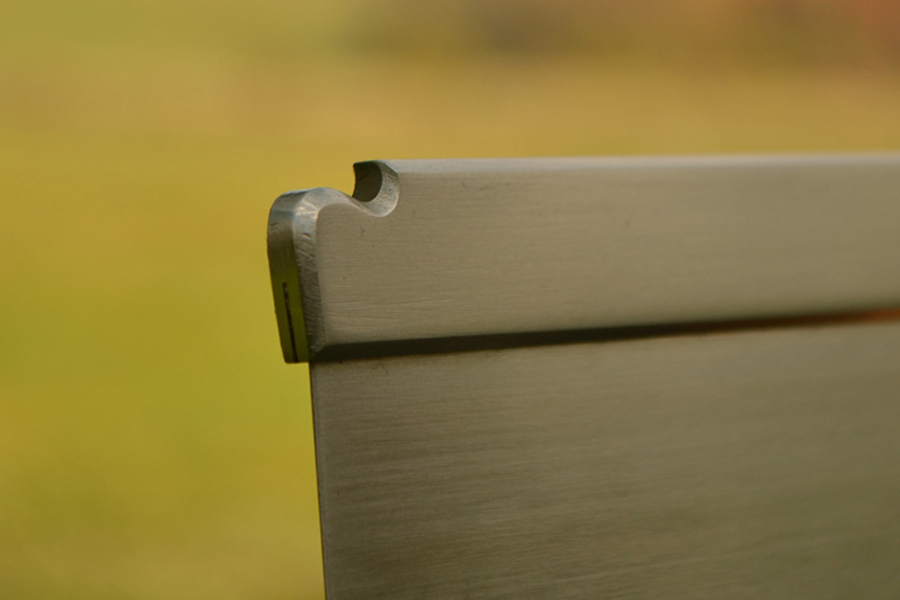 Lamb's tongue detail on stainless steel spine