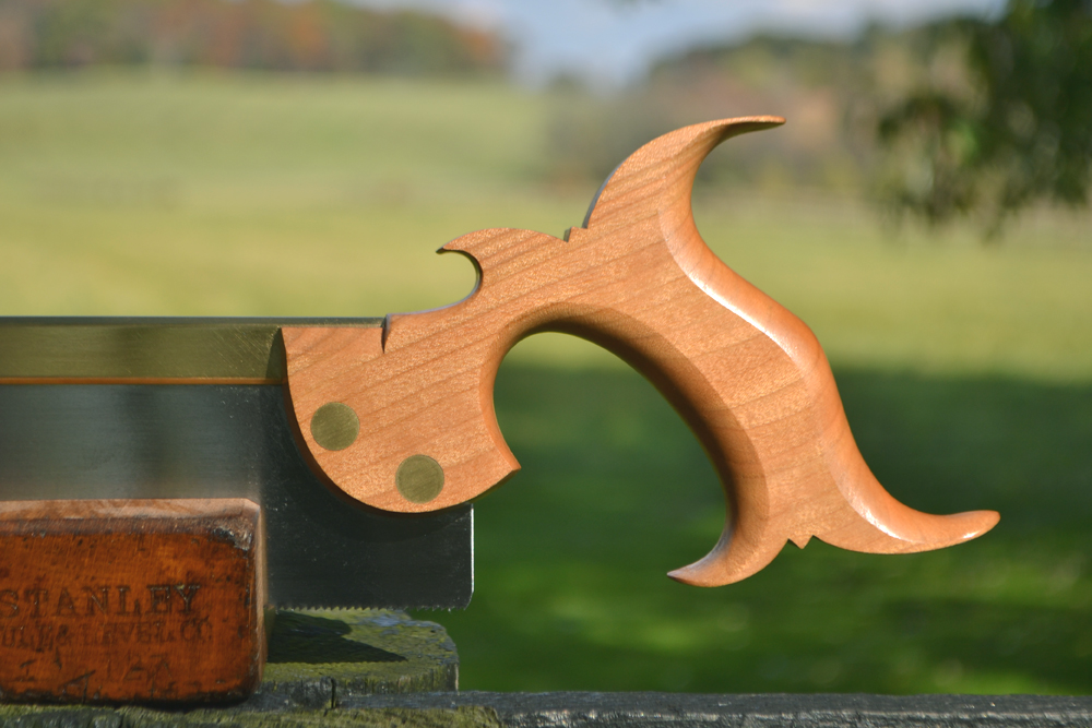 Close up view of 10 inch dovetail saw handle in rift-sawn cherry