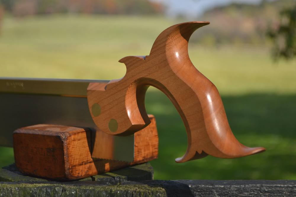 Close up view of 10 inch dovetail saw handle in rift-sawn cherry