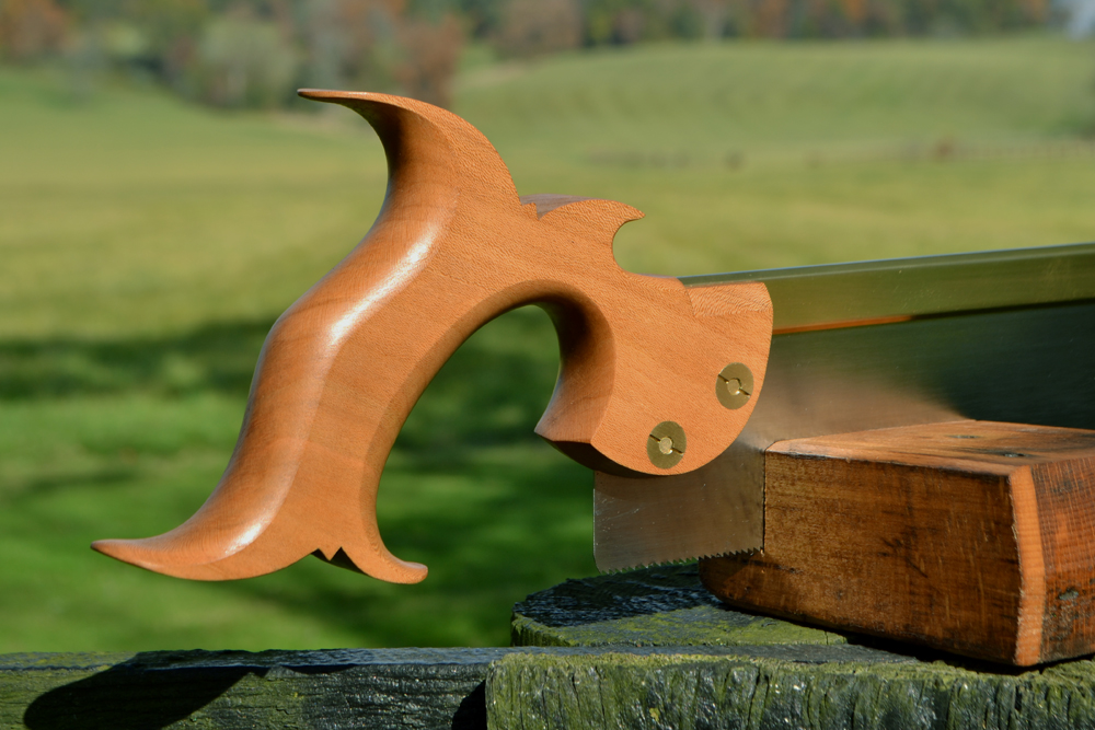 Close up view of 10 inch dovetail saw handle in rift-sawn cherry