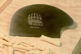 BearKat Wood chair scraper in use on curly maple